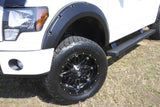 Lund 16-17 Nissan Titan XD RX-Rivet Style Smooth Elite Series Fender Flares - Black (4 Pc.)