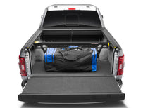 Load image into Gallery viewer, Roll-N-Lock 21-22 Ford F-150 (67.1in. Bed Length) Cargo Manager